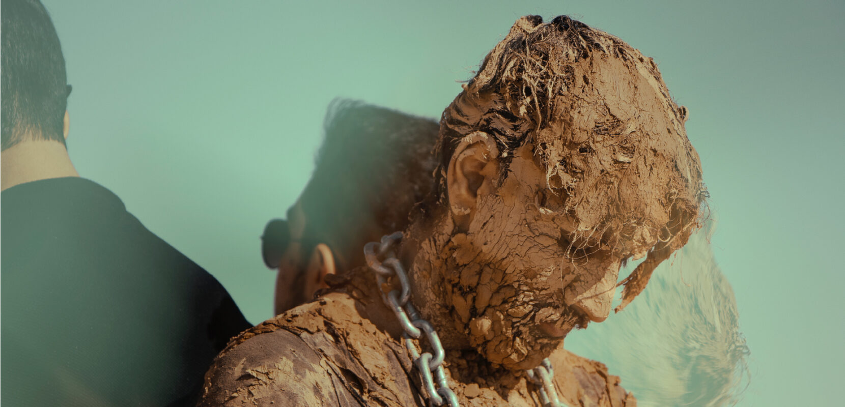 statue covered in mud