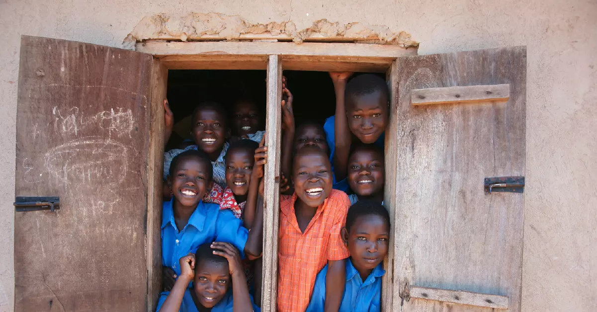 a group of children in a doorway