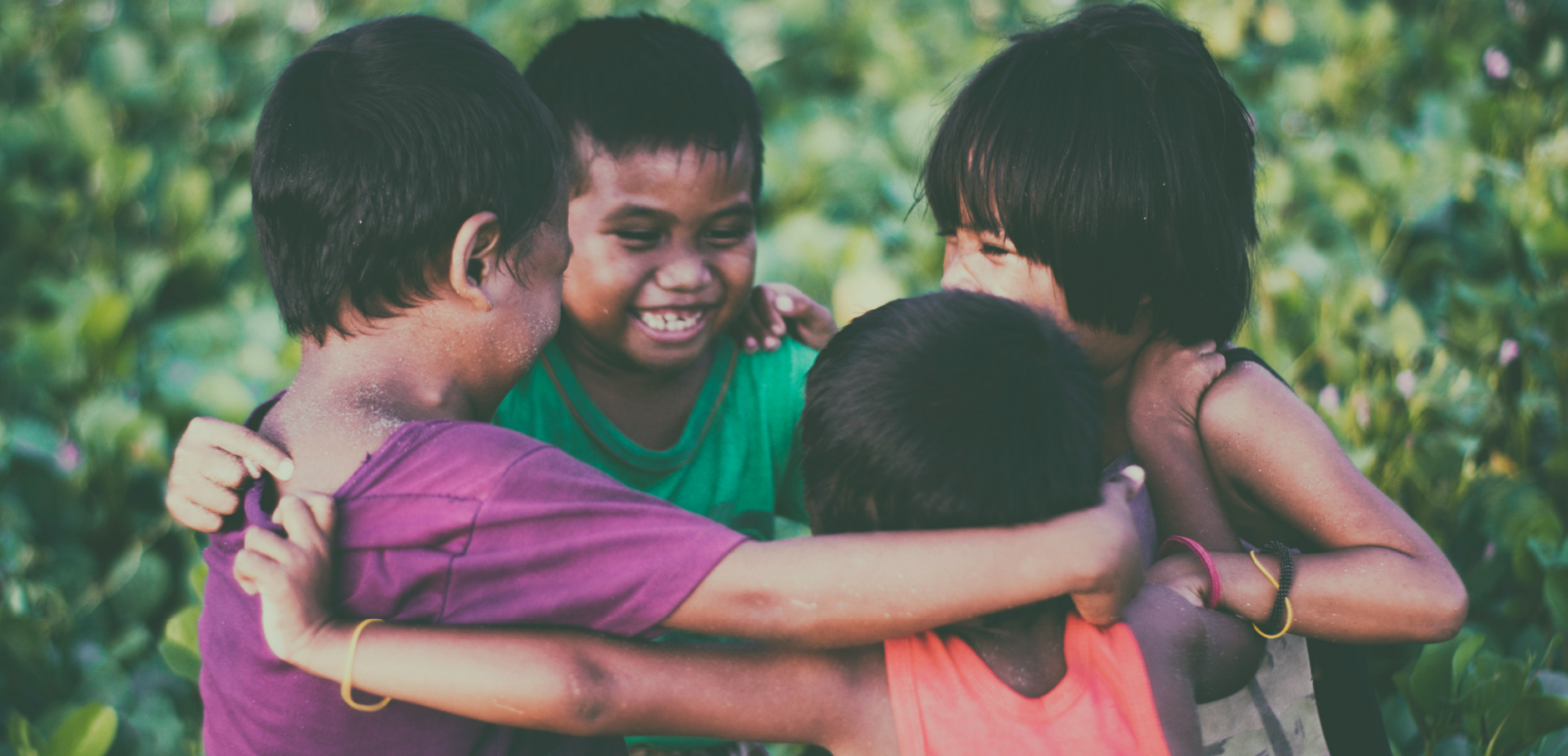 children in a circle displaying transformational generosity