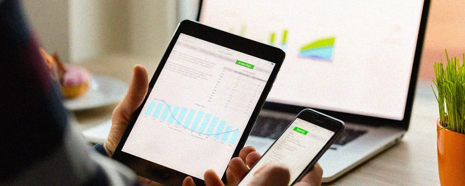 an ipad and phone displaying data