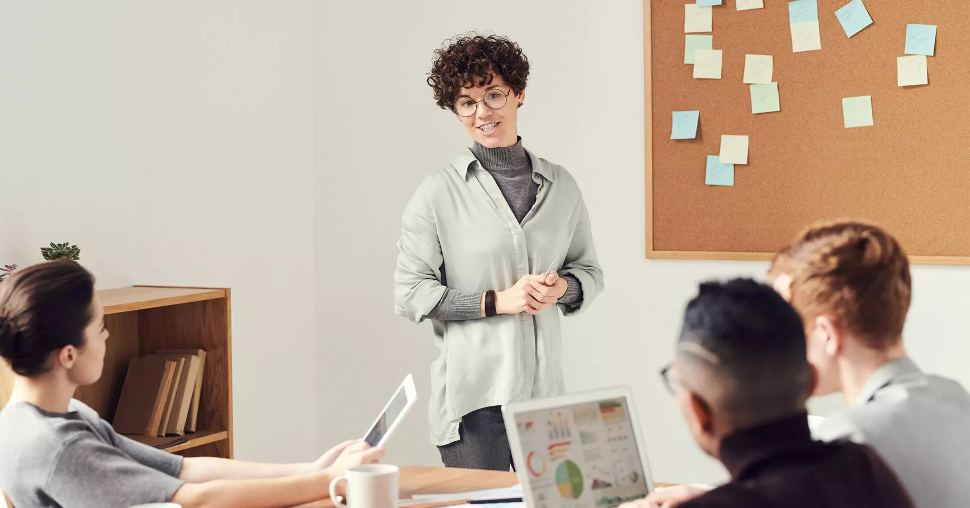 A nonprofit leader discussing with colleagues the four Keys for Fundraisers during Economic Uncertainty