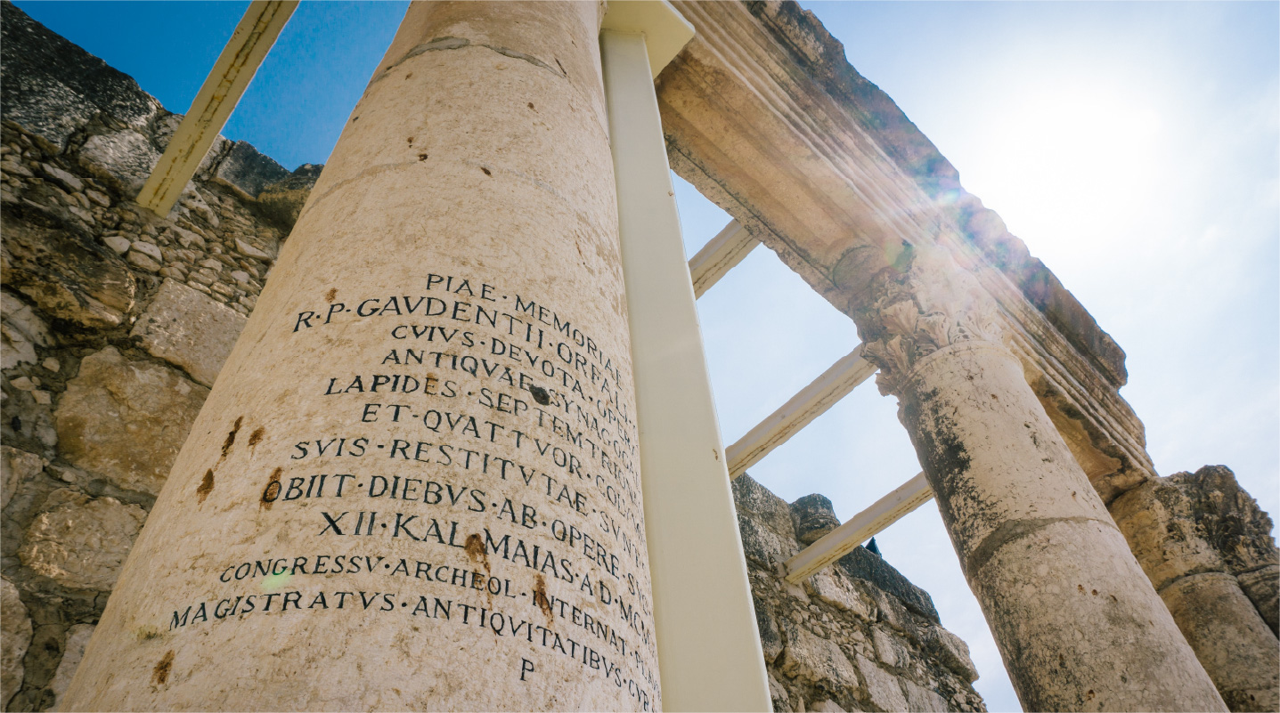 columns from an ancient city with writing on them