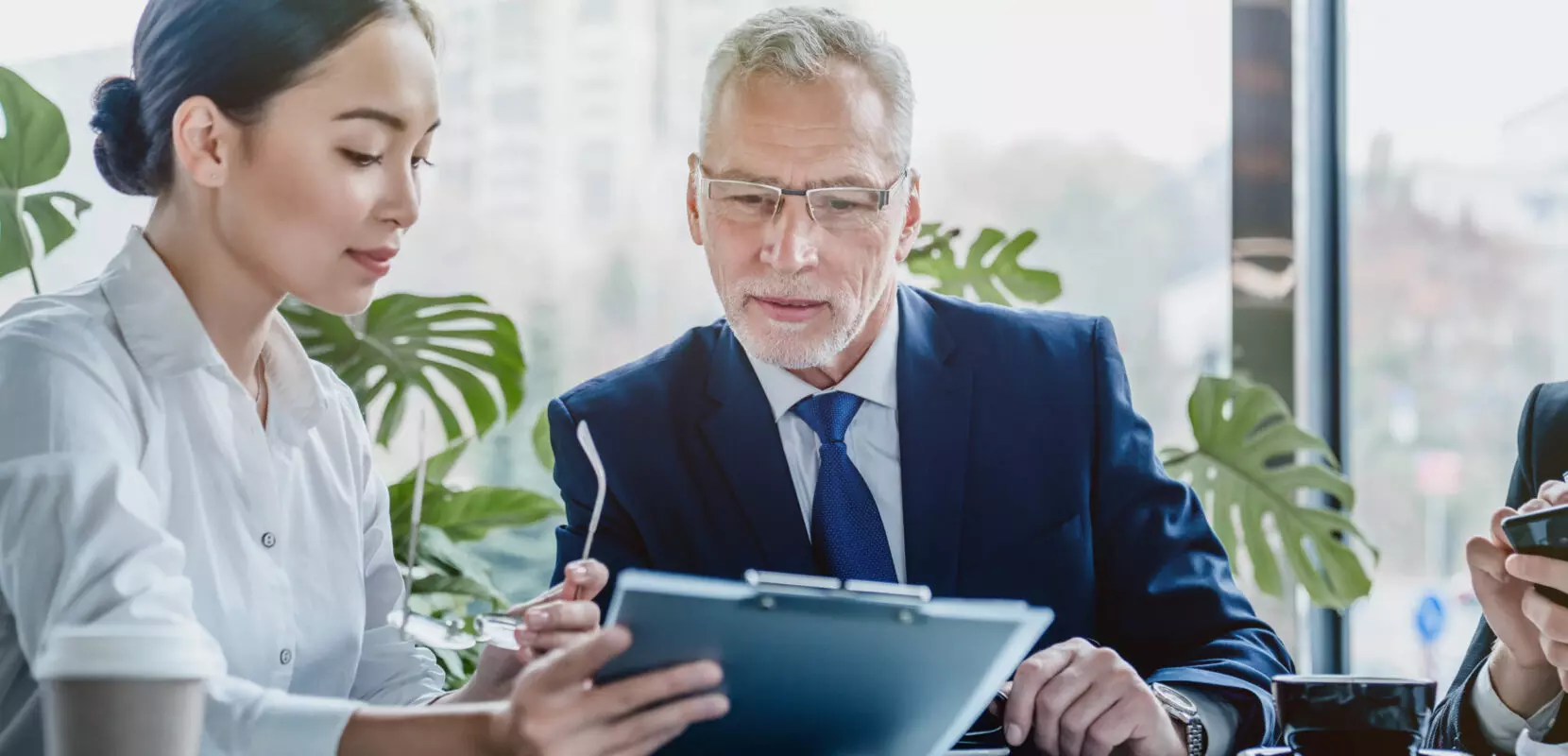 a financial advisor looking over some documents with a client