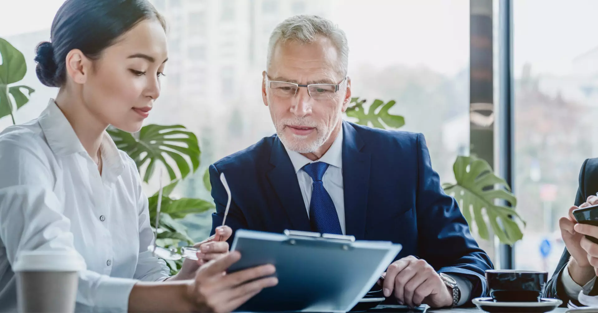 a financial advisor looking over some documents with a client