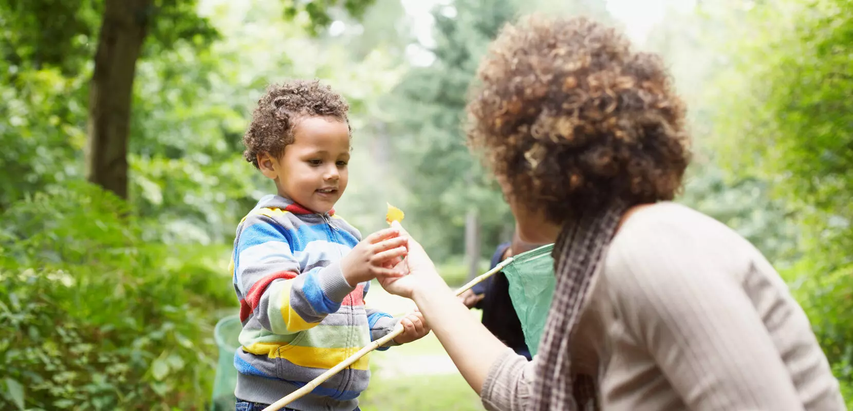 a mother teaching her son how to be generous