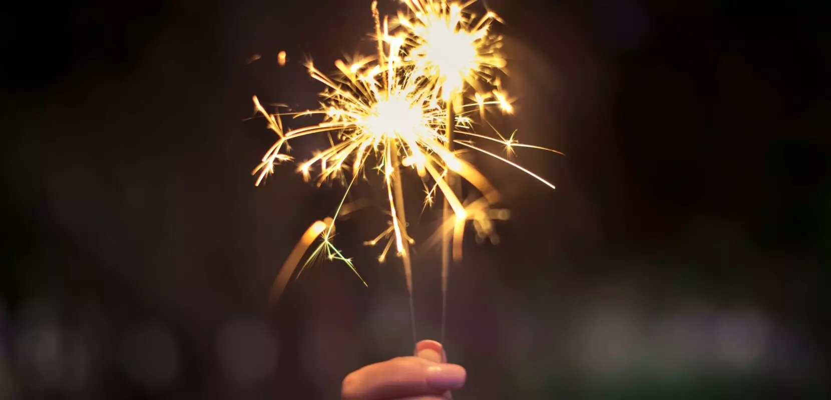 sparklers setting off sparks for new year's resolutions