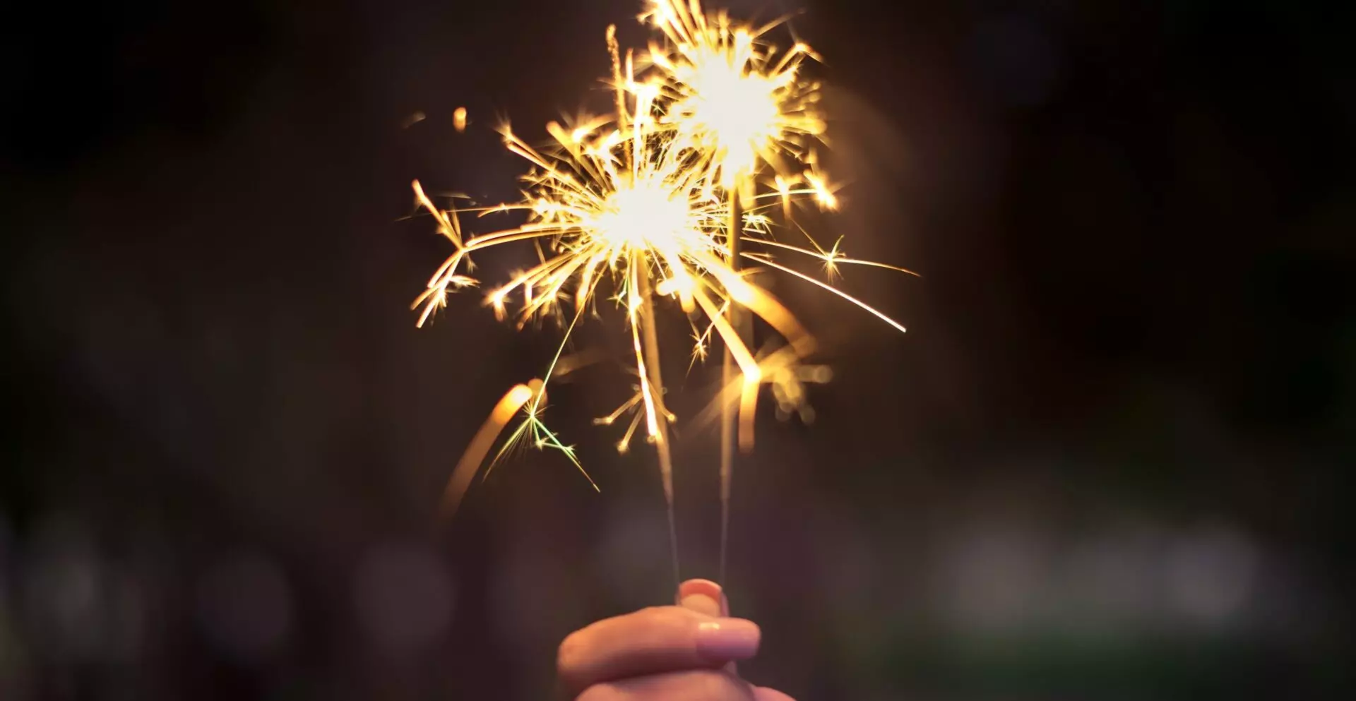 sparklers setting off sparks for new year's resolutions