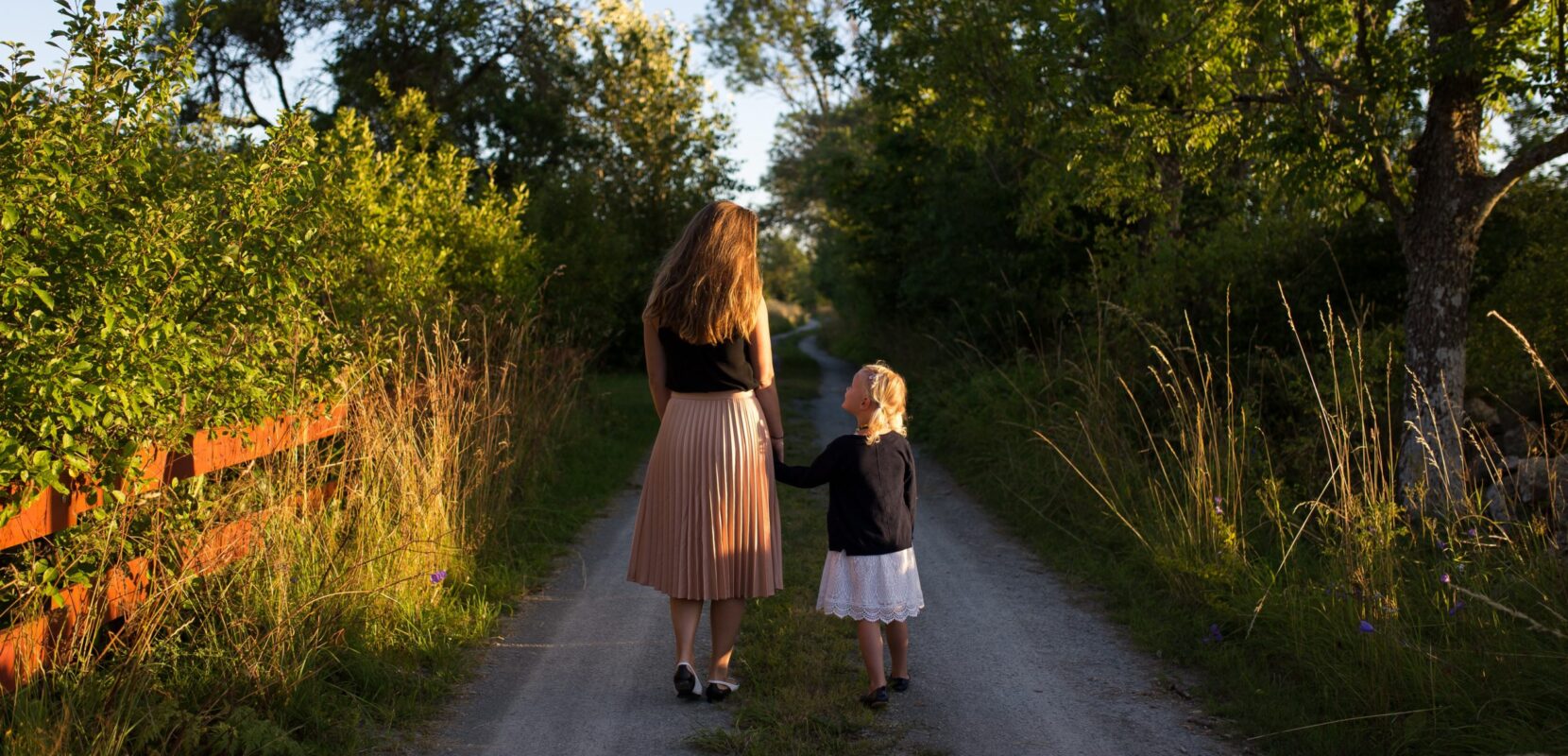 a woman and her daughter take a walk down a road as the mother tries to leave a legacy