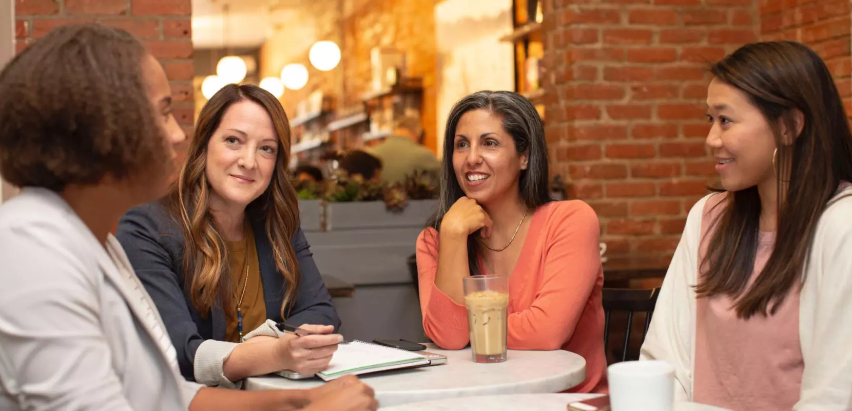 a group of women at a coffee shop