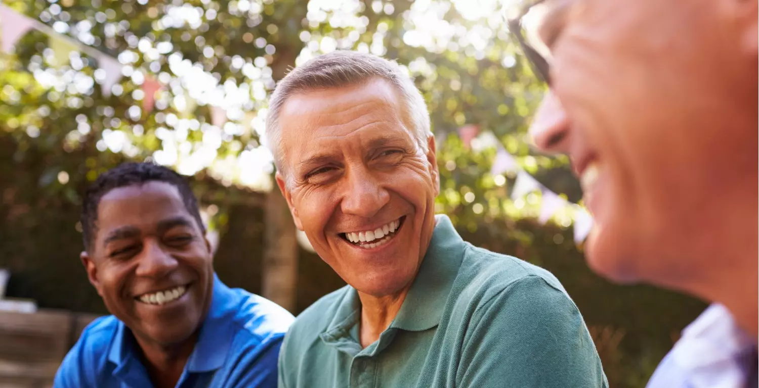 male friends socializing in the backyard together