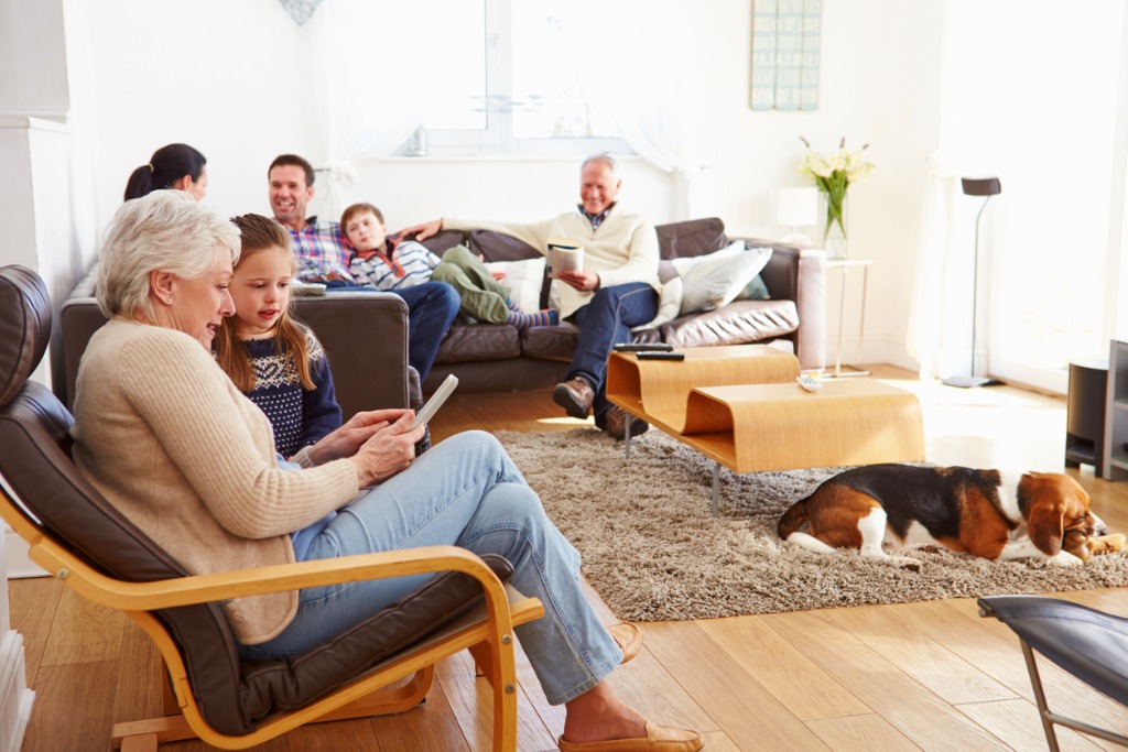 multi-generational family relaxing at home together