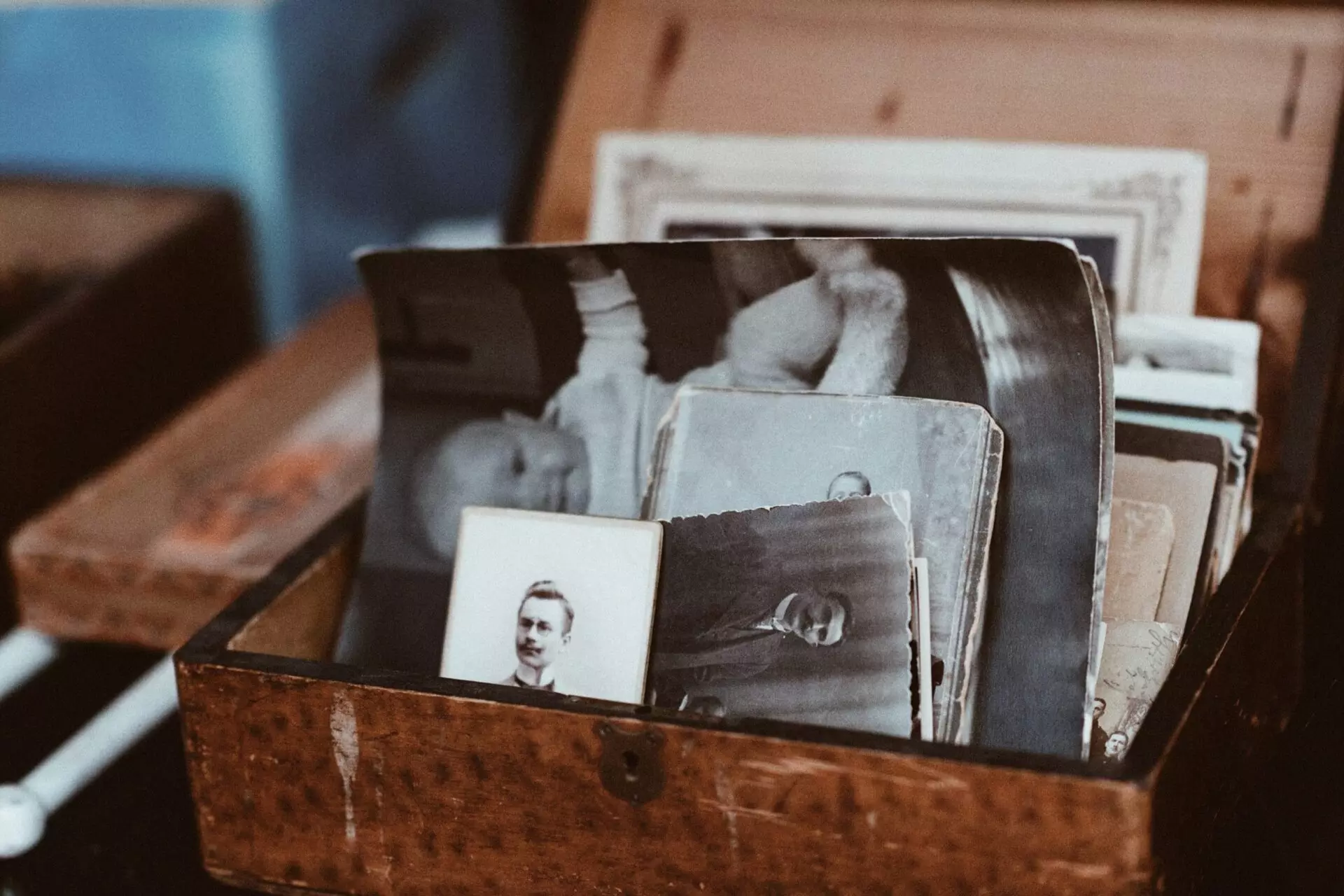 a box of old black and white family photos