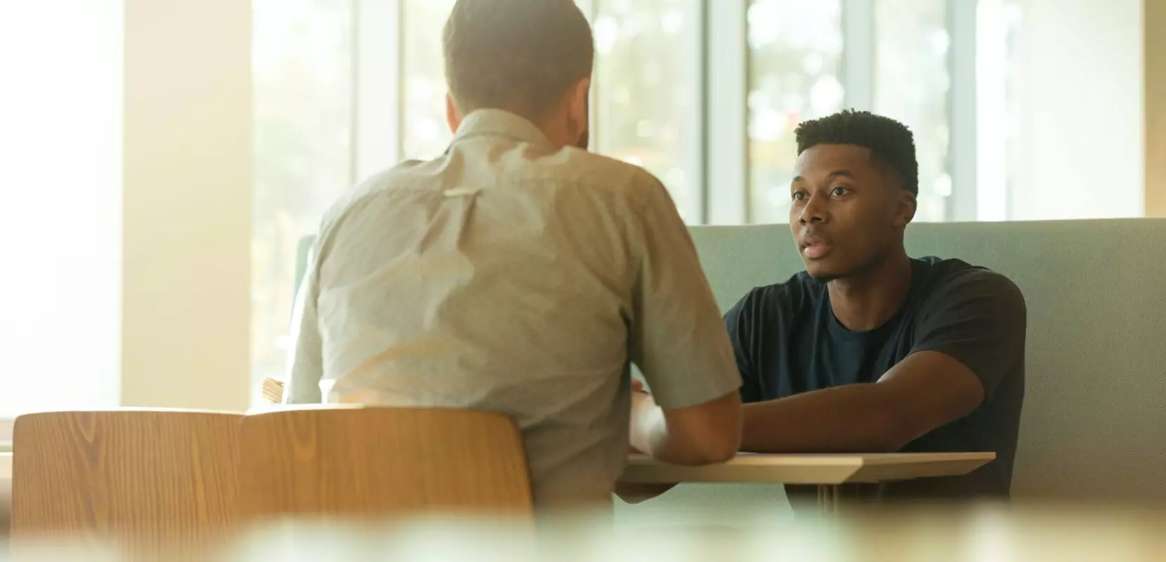 a financial advisor goes over a year-end giving checklist with a client