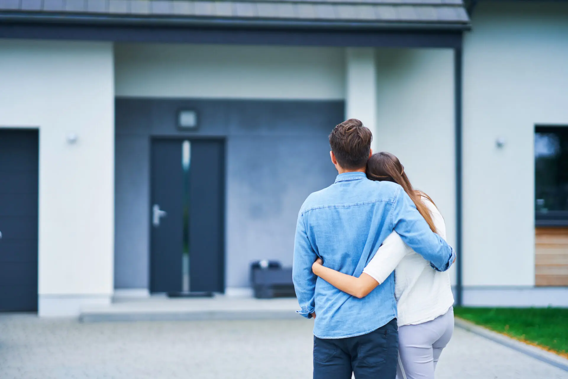 Couple in front of business building